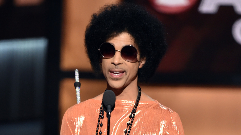 Prince wearing round sunglasses