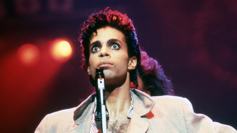 Prince appearing wide-eyed during a concert