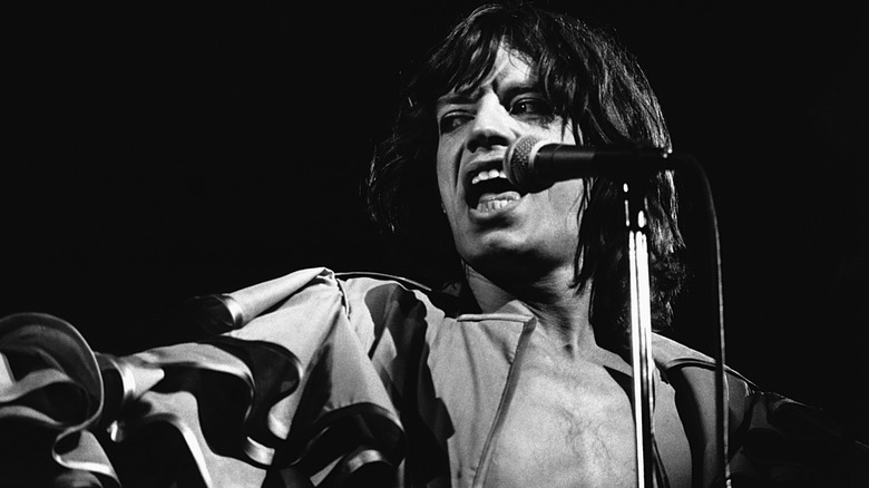 Black and white photo of Mick Jagger performing 1970s