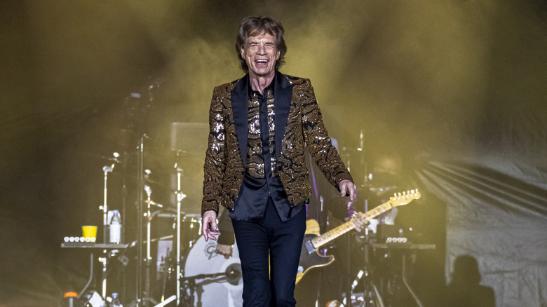 Mick Jagger on stage in a glittery jacket
