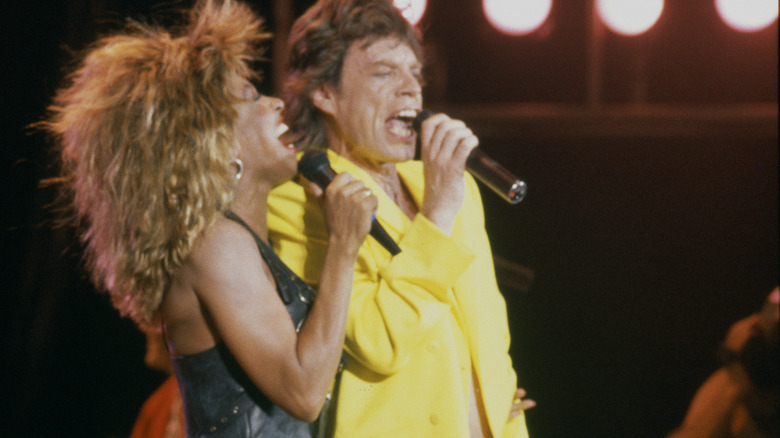 Mick Jagger performing with Tina Turner