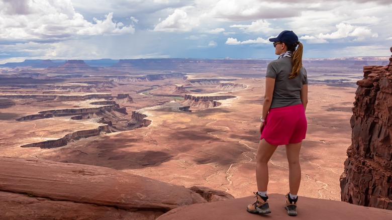 Hiker looks over Canyonlands National Park