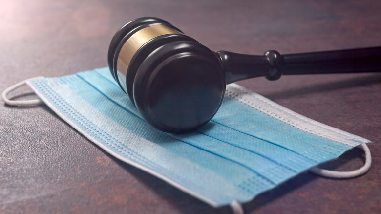 judge gavel and face mask