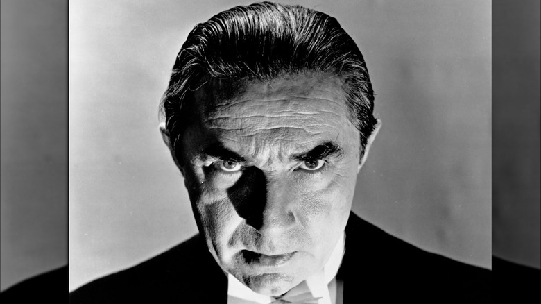 Bela Lugosi staring