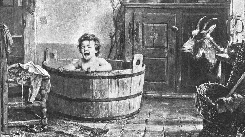baby wooden bath with goat