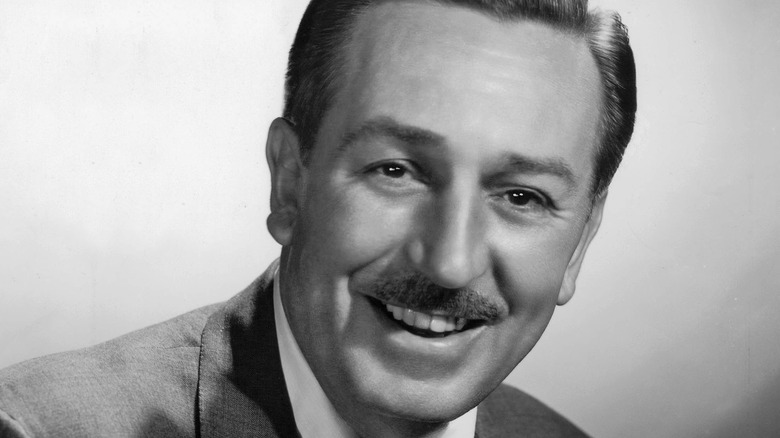 walt disney sitting and smiling