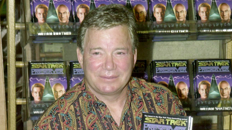 william shatner holding star trek book