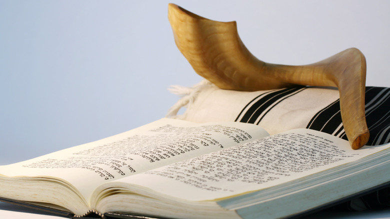 Horn rests on prayer book