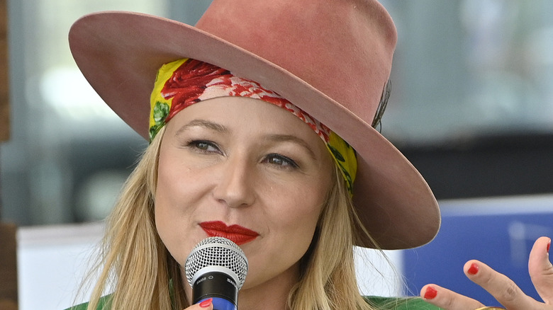 Jewel Kilcher wearing a hat