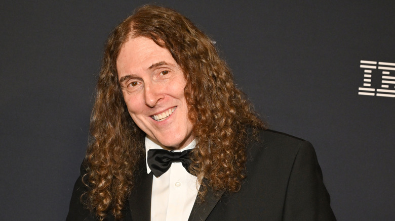 Weird Al Yankovic smiling in a tuxedo and bow tie