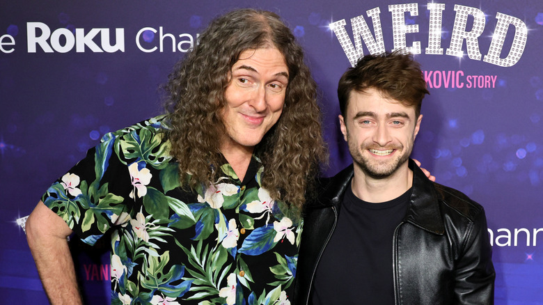 Weird Al Yankovic smiling with Daniel Radcliffe at Weird premiere