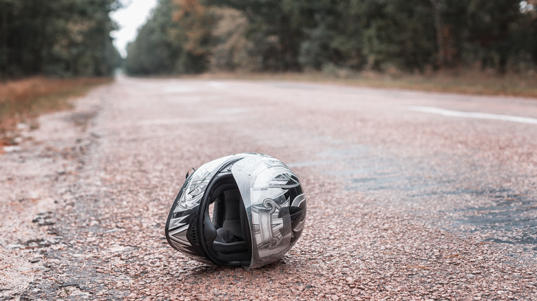 Bike helmet on the ground in rain