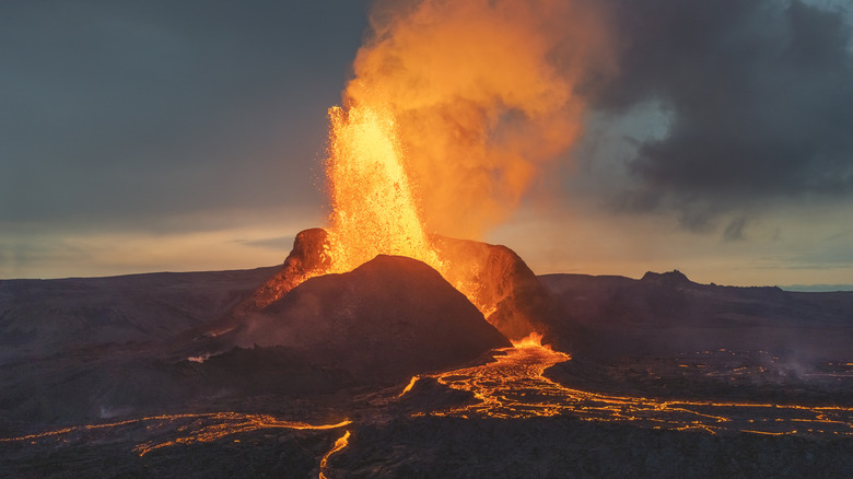 Lava erupting from Iceland volcano, evening