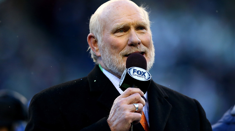 Terry Bradshaw speaking into microphone