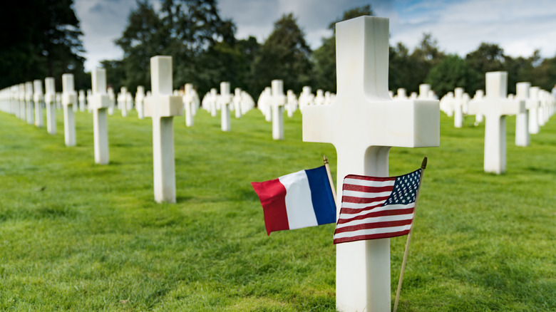 Crosses in a military cemetery with a small U.S. and French flag