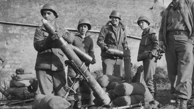 U.S. soldiers loading a mortar with shells