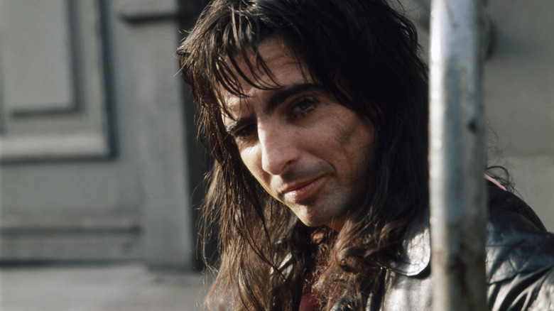 Alice Cooper sitting outside