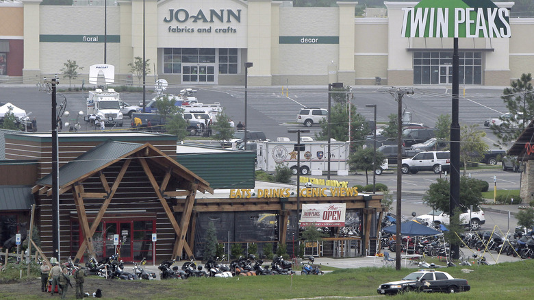 Dozens of motorcycles and a police cruiser outside of the Waco Twin Peaks restaurant