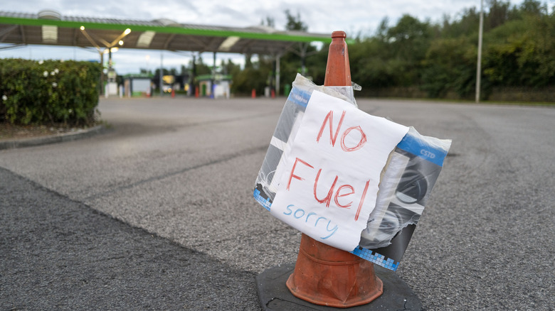 Traffic cone with "no fuel" sign