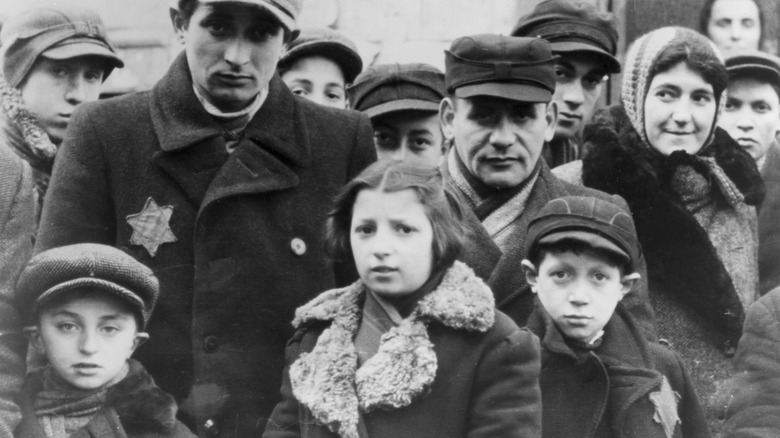 group of people wearing the yellow star of david