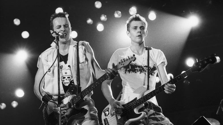 The Clash playing on stage in 1983