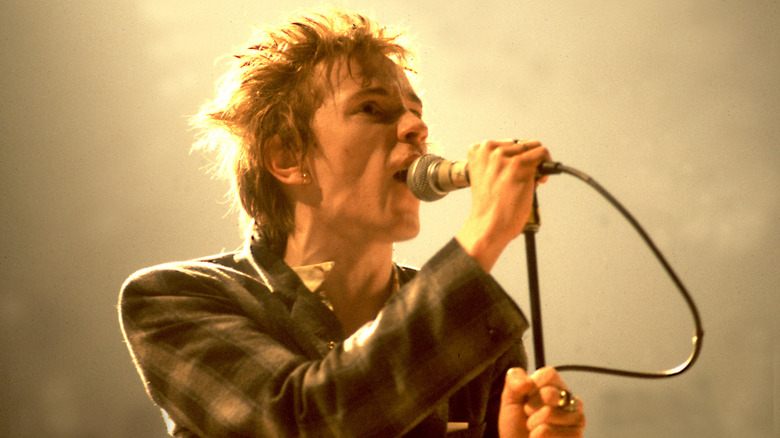 Public Image Ltd's John Lydon singing on stage in 1980
