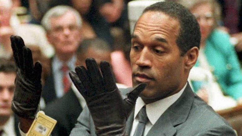 OJ Simpson holding up gloves