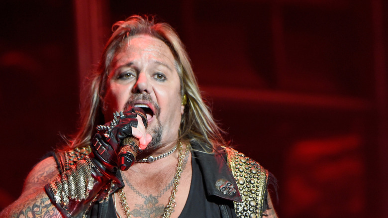 Vince Neil onstage with microphone