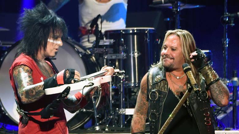 Nikki Sixx and Vince Neil onstage with Motley Crue