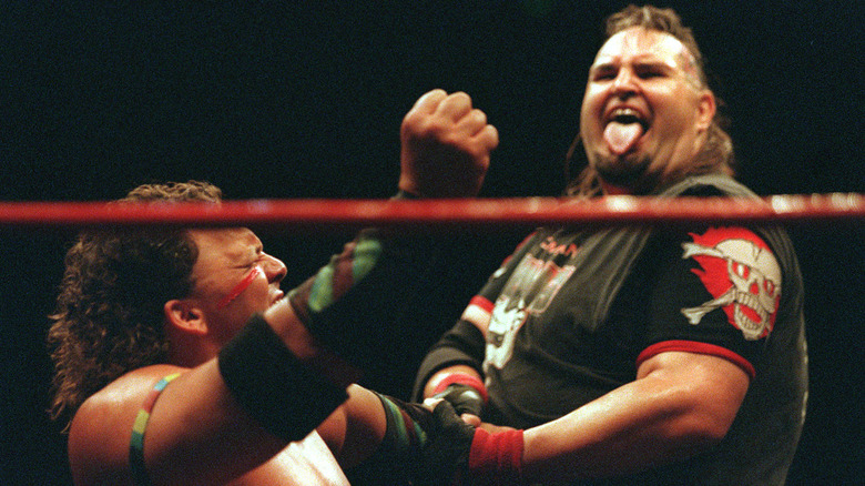 One Man Gang twisting Tatanka's arm in 2000