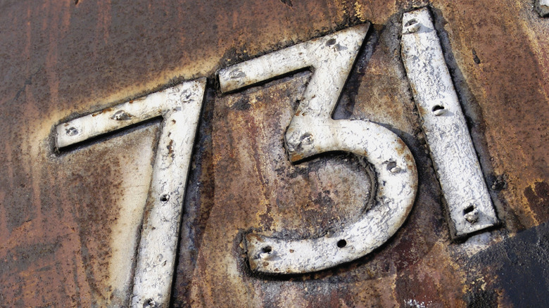 White 731 sign in rusted metal