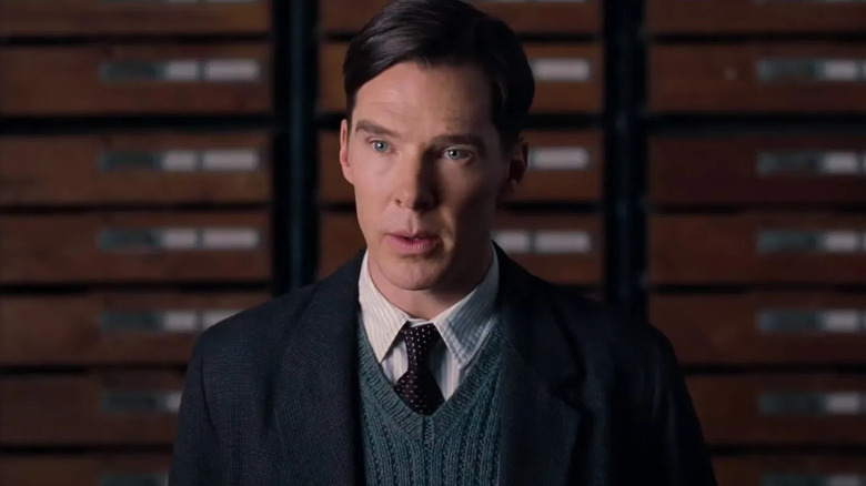 Benedict Cumberbatch as Alan Turing in knit vest and dark jacket