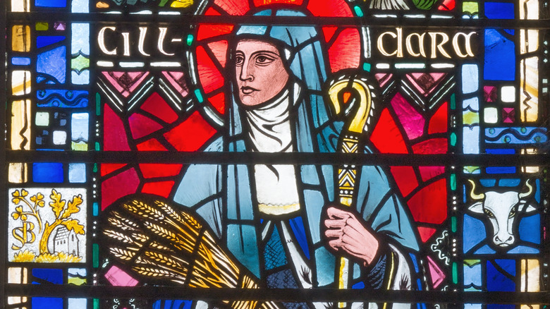 St. Brigid stained glass holding barley