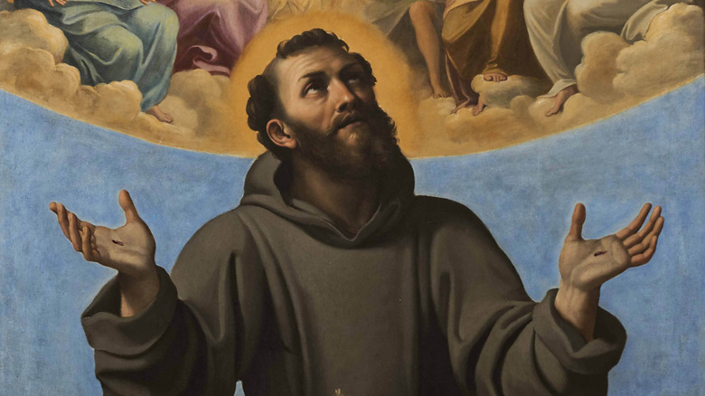Painting of Saint Francis of Assisi with open palms raised