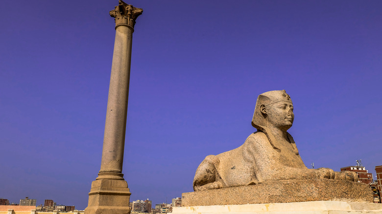 Ancient column and sphinx statue