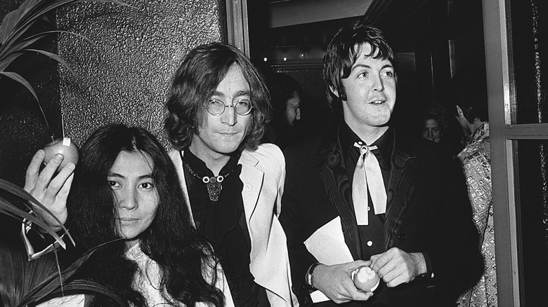 Yoko Ono and John Lennon with Paul McCartney at event