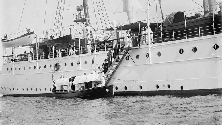 journalists filming USS Potomac