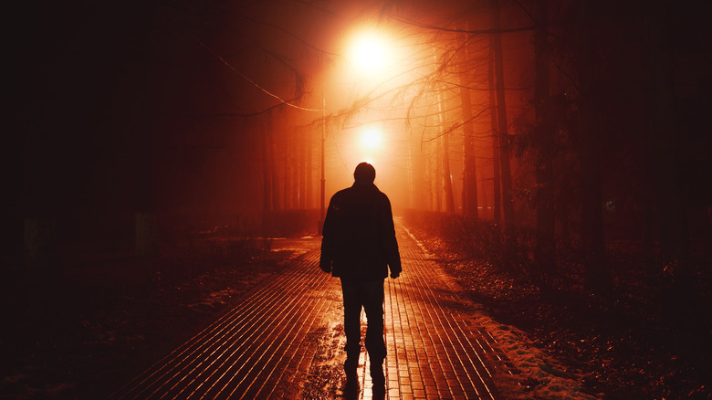 creepy figure in the dark